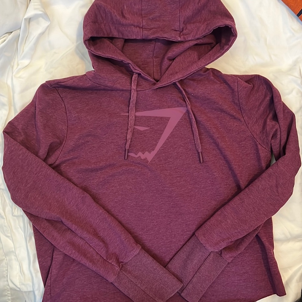 Gymshark maroon open back hoodie with logo on the front